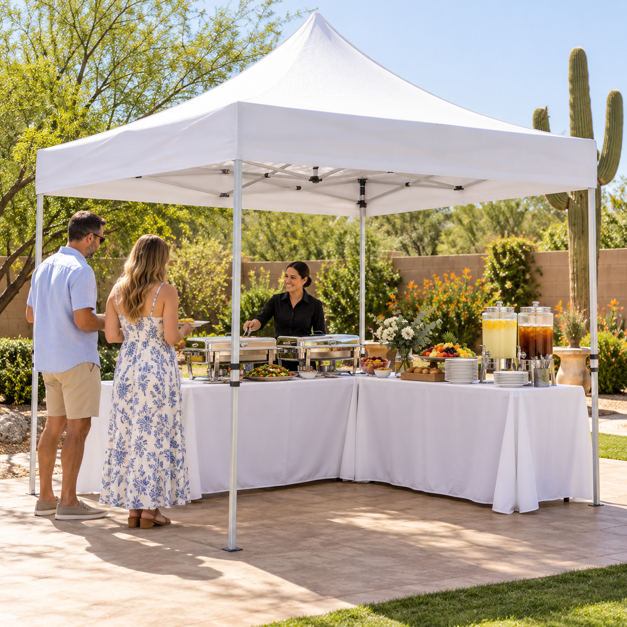 White 10-by-10-foot pop-up canopy covering two buffet tables at an Arizona backyard event